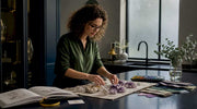 Interior designer arranging crystals on table