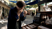 Artisan examining Swarovski crystal facets closely