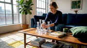 Woman arranging crystal décor in living room