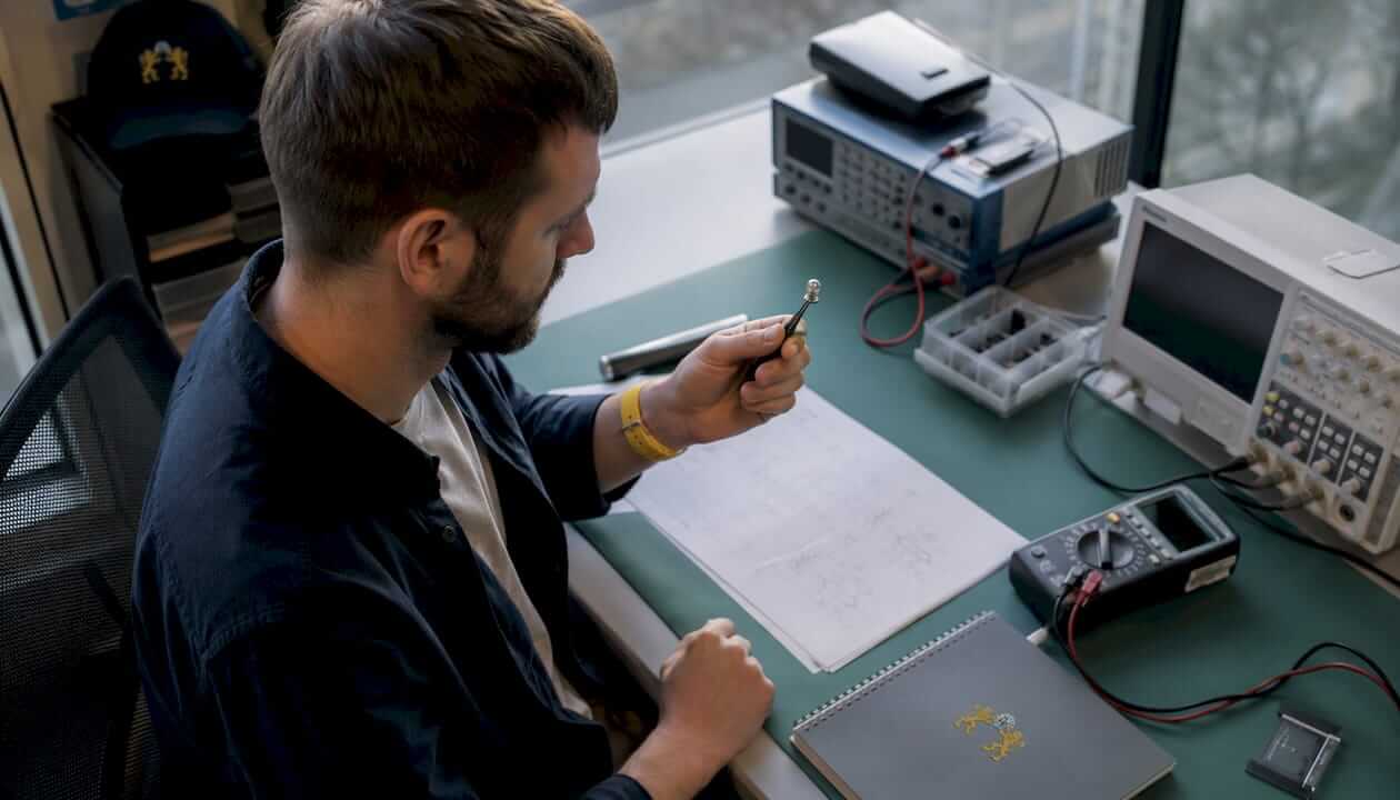 Engineer inspecting quartz crystal component