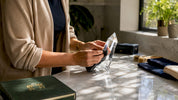Hands polishing acrylic crystal on wooden bench