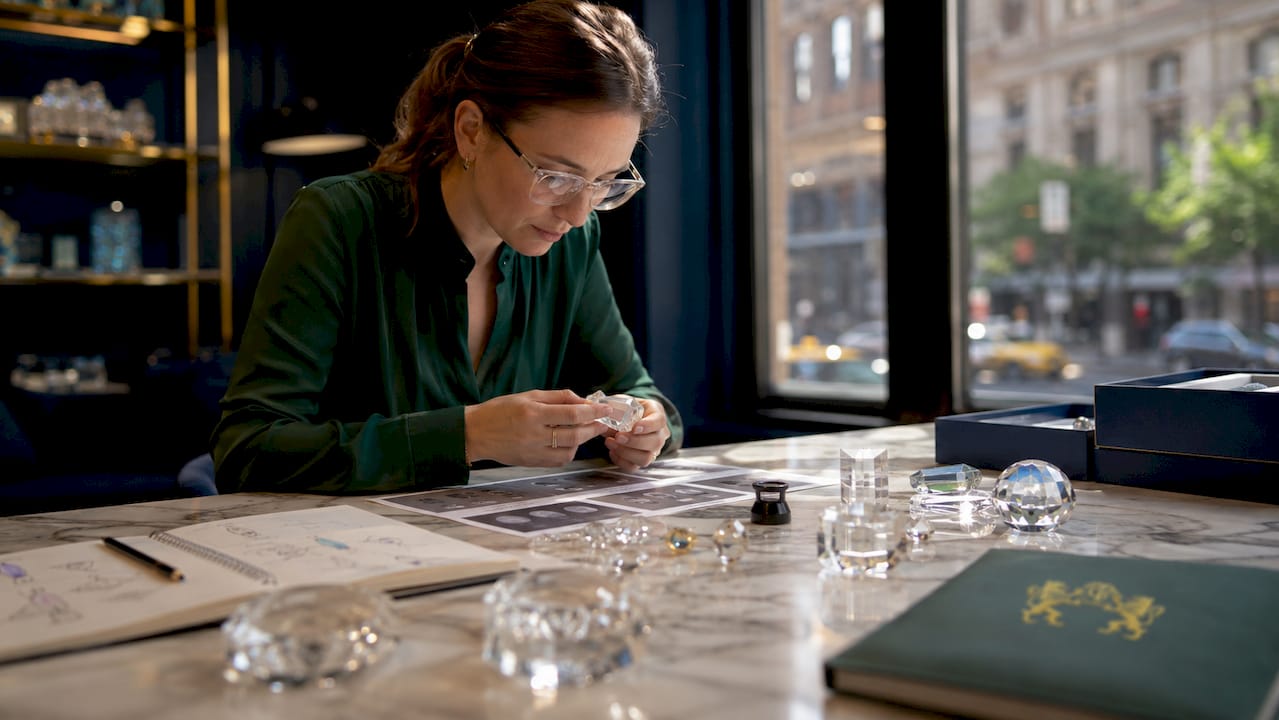 Design professional studying crystal terminology at table