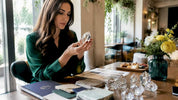 Decorator examining crystal samples at sunny desk
