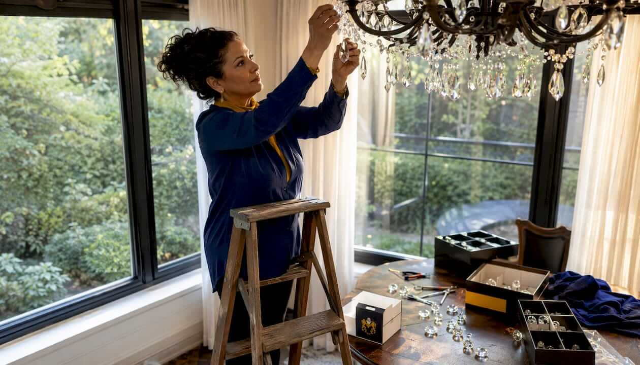 Interior designer styling crystal chandelier