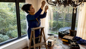 Interior designer styling crystal chandelier