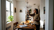 Adjusting crystal chandelier with sunlight sparkles