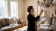 Designer examining custom crystal chandelier installation