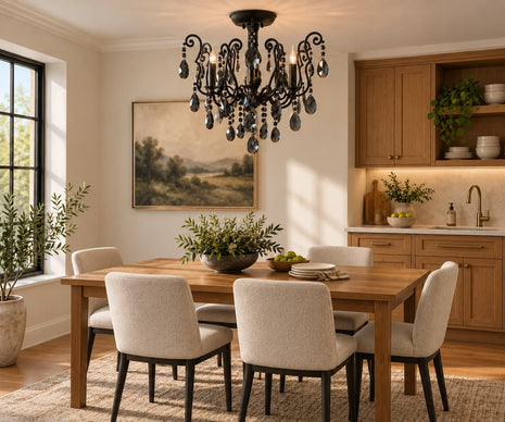 A styled dining room scene featuring a rustic wooden dining table with six upholstered dining chairs, a black metal chandelier with hanging glass teardrop crystals, a landscape painting on the wall, and a wooden kitchen cabinet unit in the background.