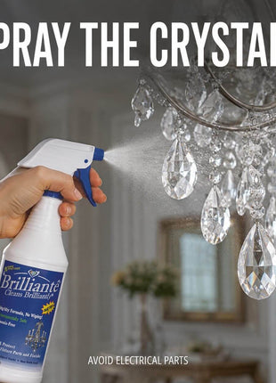Spraying chandelier crystals with Brilliante Cleaner while avoiding electrical parts