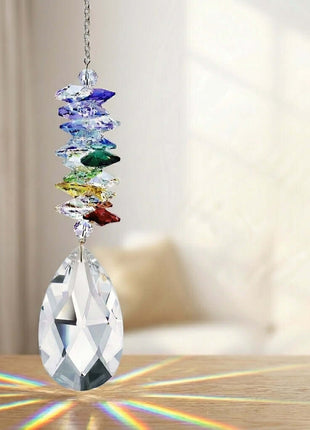 Swarovski Crystal rainbow maker with colorful stones on a wooden surface