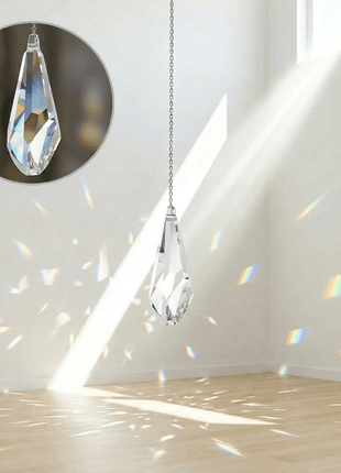 Swarovski Crystal chandelier hanging in a room with sunlight streaming through a window.