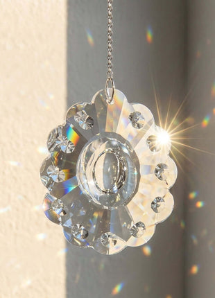 Crystal decorative hanging ornament with sunburst effect on a neutral background