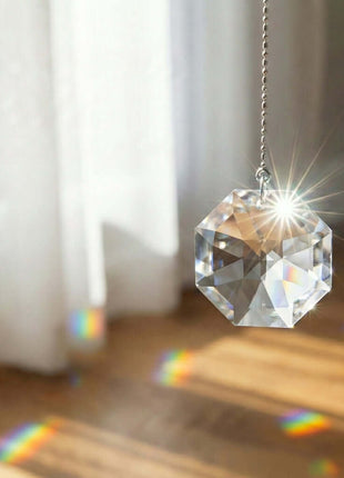 Swarovski Crystal hanging ornament with rainbow on a wooden floor