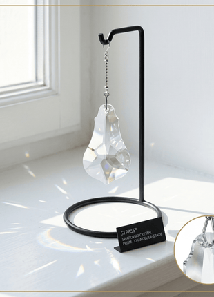 Swarovski 4 inch Crystal hanging decoration on a stand with a window in the background