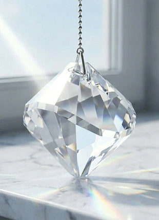 Swarovski Crystal prisms on a marble surface with a blurred background