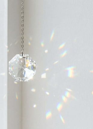 Swarovski Crystal hanging ornament with rainbowa on a white background