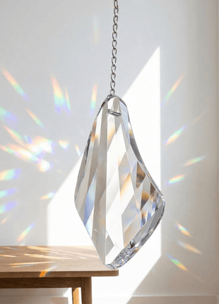 Swarovski Crystal hanging decoration with rainbow on a white wall