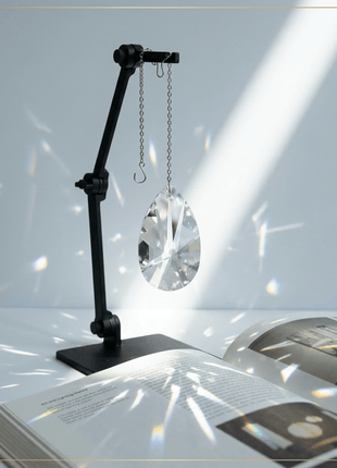 Swarovski Crystal lamp on a stand over an open book with a soft light effect