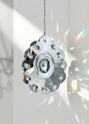 Crystal sun catcher with rainbow effect on a white background