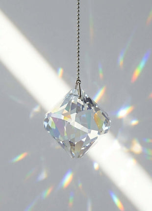 Swarovski Crystal hanging ornament with rainbow on a gray background