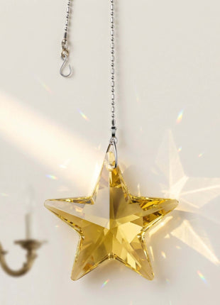 Clear star-shaped ornament hanging against a light background