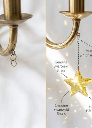 Swarovski star ornament with Swarovski Strass on a chandelier, showing details like chain and hook.
