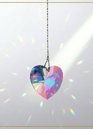 Swarovski Heart-shaped crystal pendant with rainbow colors on a white background