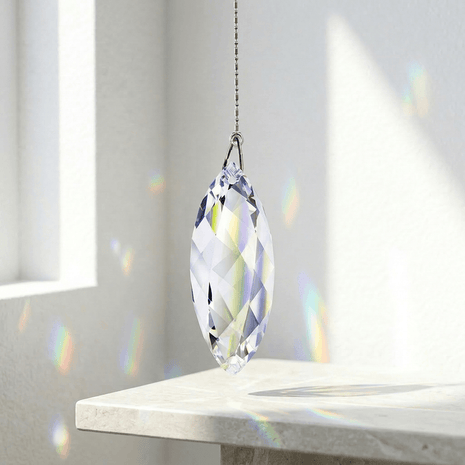 Swarovski Crystal prism hanging on a stand with rainbow