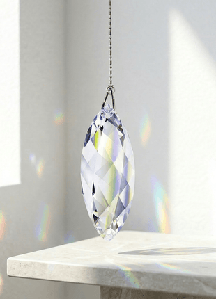 Swarovski Crystal prism hanging on a stand with rainbow