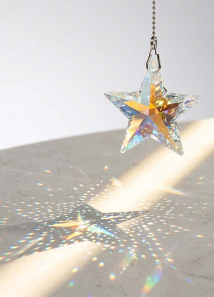 Swarovski Star-shaped crystal hanging on a white background