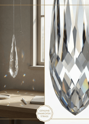 Two crystal prisms hanging in a room with a desk and window.