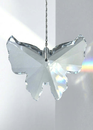 Crystal butterfly ornament with rainbow effect on a white background