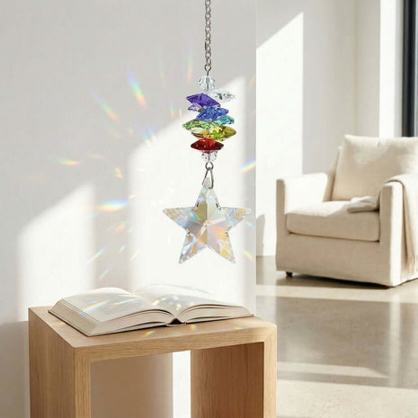 Swarovski Crystal rainbow star hanging above an open book