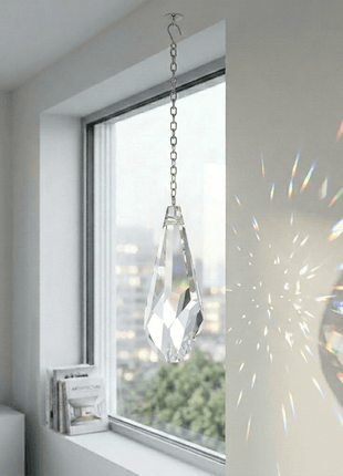 Swarovski Crystal hanging in a room with a window