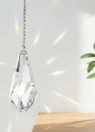 Swarovski Clear crystal hanging ornament with chain on a light background