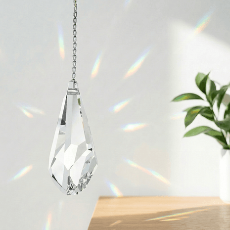 Swarovski Clear crystal hanging ornament with chain on a light background
