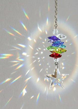 Colorful Swarovski crystal suncatcher with rainbow effect on a light gray background